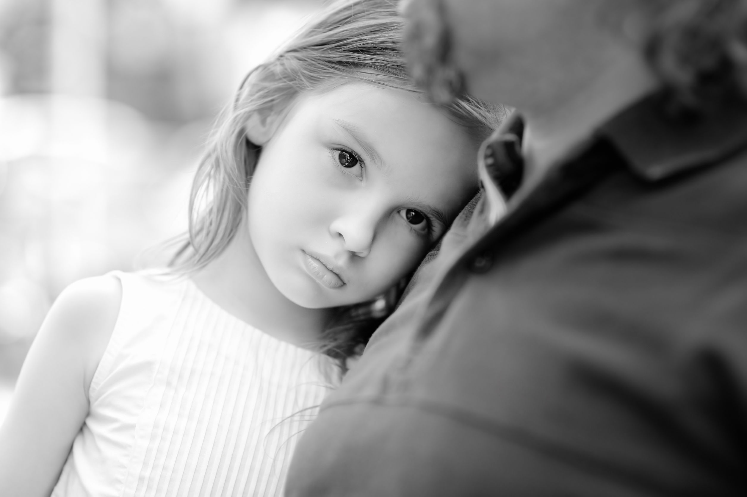 43192349 - black and white photo of sad little girl with her father